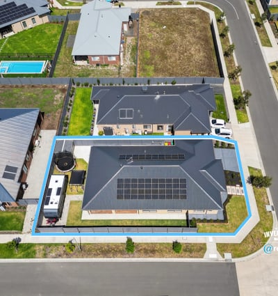 Spacious property featuring solar panels, ample outdoor space, and convenient access to local amenities.