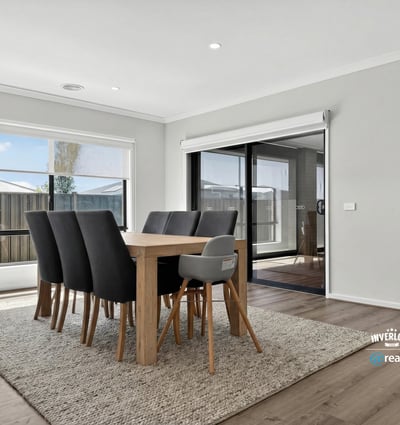 Spacious dining area with natural light, perfect for gatherings and enjoying views of the outdoor space.