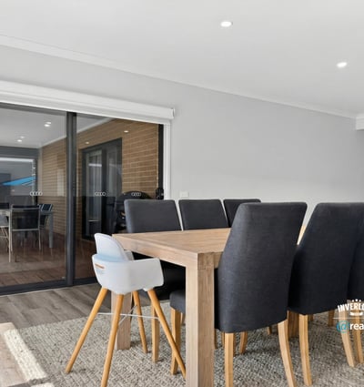 Bright dining area seamlessly connects to an outdoor space, perfect for entertaining family and friends.