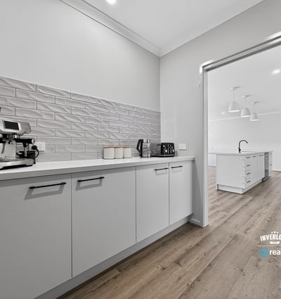 Modern kitchen featuring sleek cabinetry and ample space, perfect for culinary enthusiasts and entertaining guests.