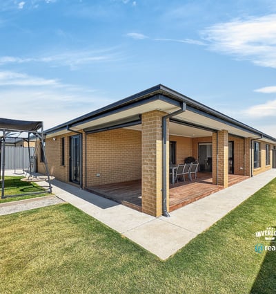 Spacious outdoor area with a covered patio, perfect for entertaining and enjoying family gatherings year-round.