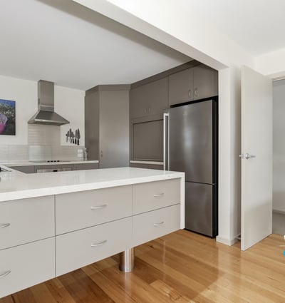 Modern kitchen features sleek cabinetry and a functional layout, perfect for culinary enthusiasts and entertaining.