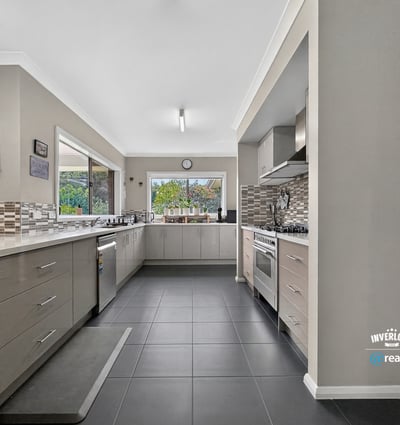 Spacious kitchen featuring modern appliances, ample storage, and natural light, perfect for culinary enthusiasts.