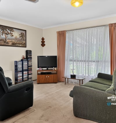 Bright and inviting living area featuring ample natural light and a welcoming atmosphere for relaxation.