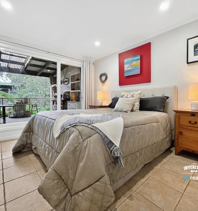 Bright and inviting bedroom featuring direct access to a private outdoor terrace for relaxed living.