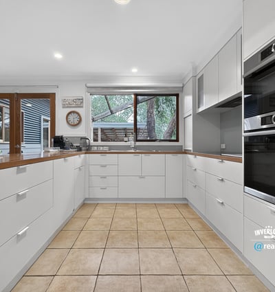 Modern kitchen featuring ample storage, contemporary appliances, and a spacious layout ideal for cooking and entertaining.
