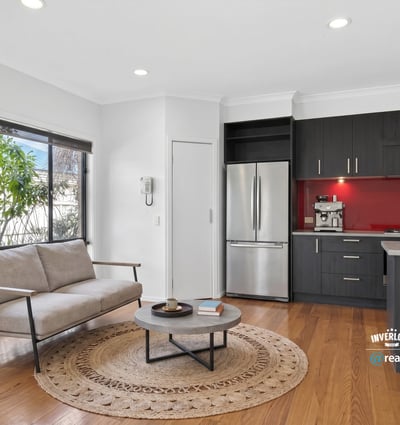 Modern kitchen and inviting living area with natural light, perfect for comfortable daily living.