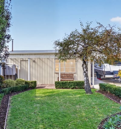 This modern property features a landscaped garden and inviting outdoor space perfect for relaxation and entertainment.
