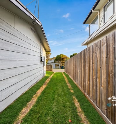 This property features a spacious side yard, perfect for outdoor activities or potential landscaping opportunities.