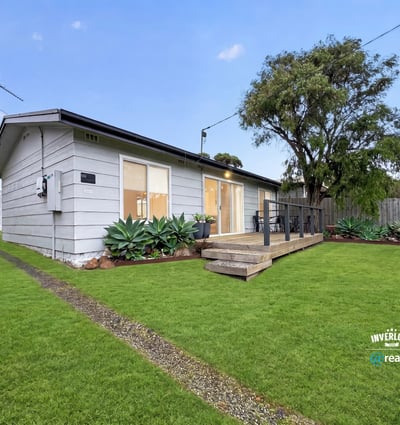 Bright and inviting home featuring a spacious yard, perfect for outdoor gatherings and relaxation.