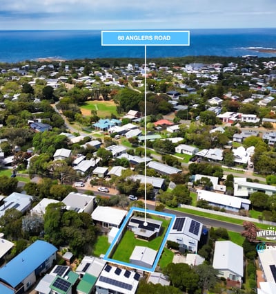 Discover a prime coastal property at 98 Anglers Road, surrounded by lush greenery and stunning ocean views.
