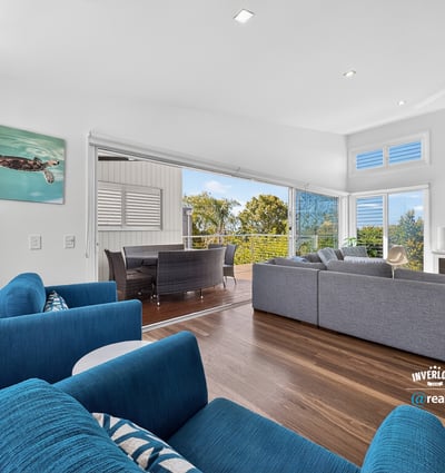 Modern open-concept living space featuring ocean views, ideal for entertaining and relaxation.