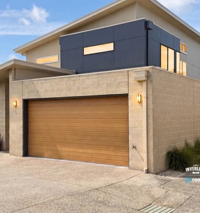 Modern two-story home featuring spacious interiors and a unique architectural design, perfect for contemporary living.