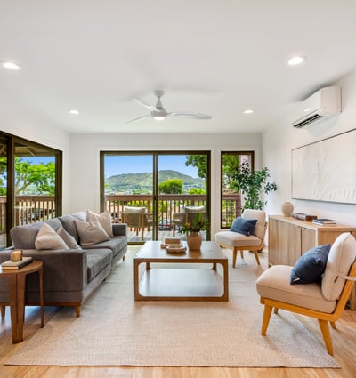 Bright and airy living space featuring modern decor and expansive views from large windows.