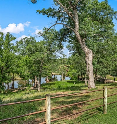 Scenic property featuring lush greenery and peaceful views of a tranquil river, ideal for nature enthusiasts.