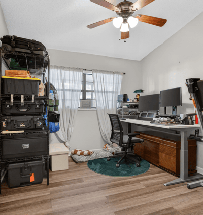 This versatile room offers ample storage, ideal for a home office or creative space.