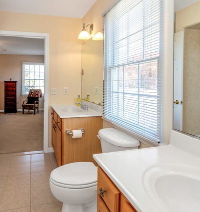 A Jack and Jill Bathroom is shared by bedrooms 3 and 4. Double sinks, tiled shower/tub.