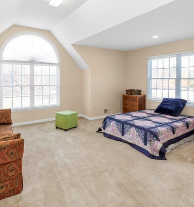 Bonus Room features an attractive arch-top double window and a high ceiling. Two extensive storage spaces are accessed via doors near room entry.