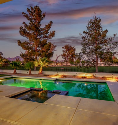 The pool glows beautifully at dusk, creating a serene and inviting atmosphere for evening entertaining or quiet relaxation.