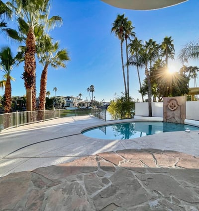 Breathtaking lakefront view lined with palms and lush landscaping. A serene Scottsdale escape designed for peace and beauty.