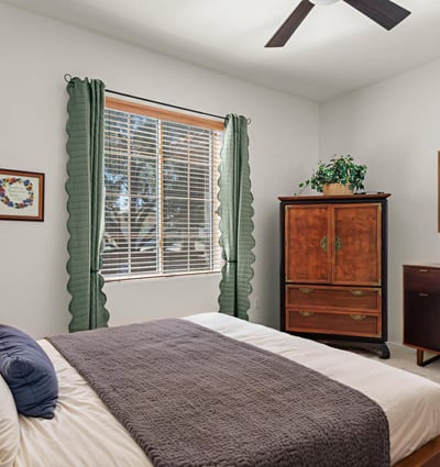 The guest room offers soft light, warm tones, and a peaceful feel ideal for guests or multi-purpose use.