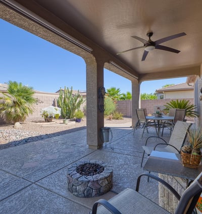 Enjoy peaceful mornings or evening sunsets in this private, low-maintenance backyard featuring native plants and decorative pavers.