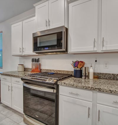 Featuring granite counters, stainless range, and abundant cabinetry, this updated kitchen blends efficiency and modern design perfect for today s Litchfield Park buyer.