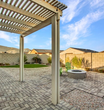 This covered pergola area captures peaceful mountain scenery while offering ample shaded outdoor living space in Litchfield Park.