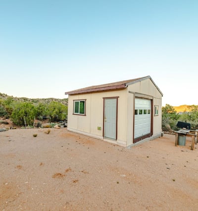 Set against acres of open land, this detached shed is perfect for workshop needs, storage, or equipment use. Its placement offers privacy and sweeping Hackberry views.