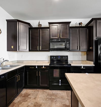 Kitchen storage highlighted by plentiful cabinetry and functional counter space, supporting organized and efficient meal prep.