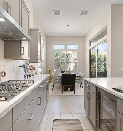 Open kitchen layout connecting effortlessly to dining and living areas, maximizing space, light, and functionality for modern lifestyles.