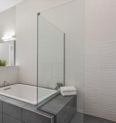 Contemporary spa-style bathroom featuring clean lines, premium tilework, and a spacious walk-in shower.