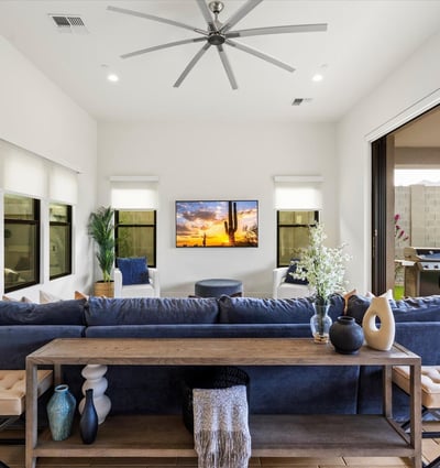 Living room with large sliding glass doors opening to the covered patio, creating true indoor-outdoor living. Designed for entertaining and enjoying Scottsdale s climate.
