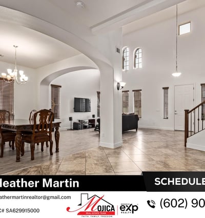 This open-concept design blends tile entry and wood-look flooring for visual warmth. High ceilings and elegant arches add architectural charm to this Glendale residence.