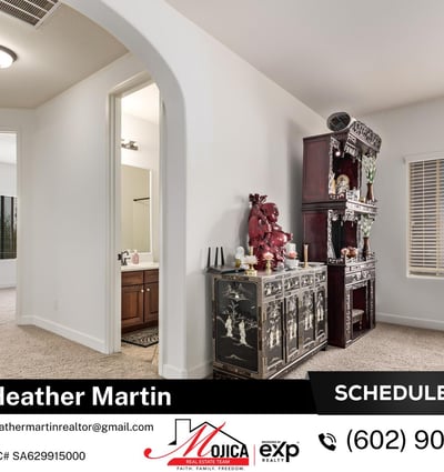 Filled with natural light, this loft area offers flexibility for modern living needs. Plush carpeting and open railing details contribute to the comfortable layout of this Glendale residence.