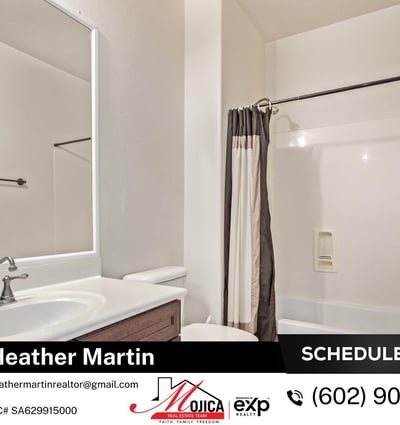 This secondary bathroom offers a full tub and shower combo, spacious vanity, and warm cabinetry for added storage. Neutral tile and updated fixtures complement the move-in-ready design of this Glendale home.