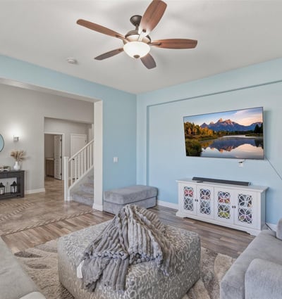 View from the living room toward the open entryway, showcasing the spacious layout, tall ceilings, and modern finishes throughout the home.