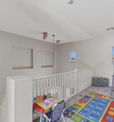Large loft area overlooking the main entry, offering flexible space for a playroom, lounge, or second living room.