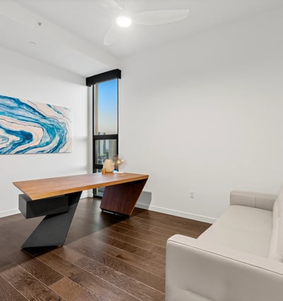 Spacious and flexible room designed for use as a bedroom or office, featuring modern finishes and abundant natural light in this Phoenix home.