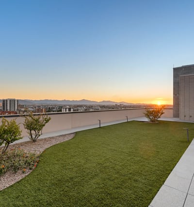 Elevated rooftop capturing colorful sunset skies and cityscape views, perfect for relaxing evenings in Phoenix.