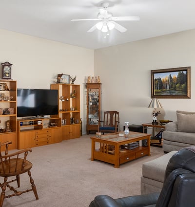 Spacious Phoenix living room with neutral finishes, ample seating, and inviting atmosphere designed for everyday comfort and gatherings.