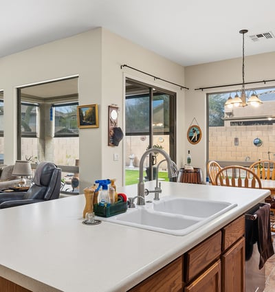 Open concept layout blending kitchen, dining, and living spaces for effortless entertaining and modern Phoenix living.