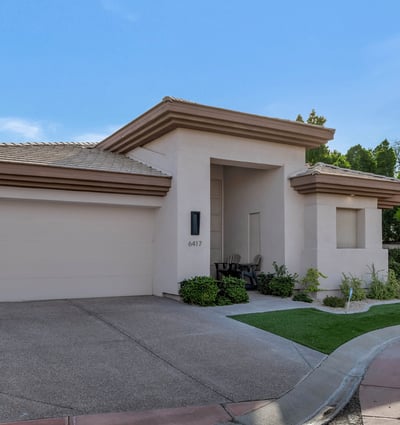 Modern Phoenix exterior featuring a clean facade, private entry, and attached garage in a desirable community setting.