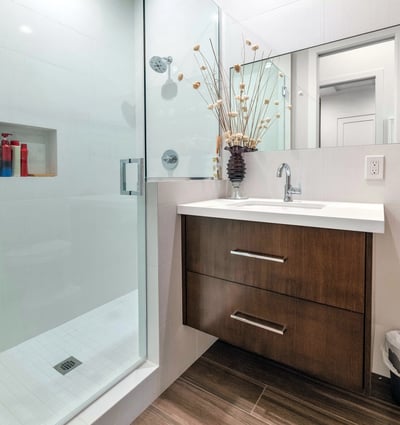 Contemporary bathroom featuring a glass-enclosed shower, modern vanity, and clean design elements in this updated Phoenix residence.