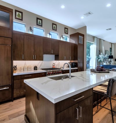 Beautiful kitchen featuring quartz counters, ample cabinetry, and a large island ideal for cooking and entertaining in this Phoenix home.