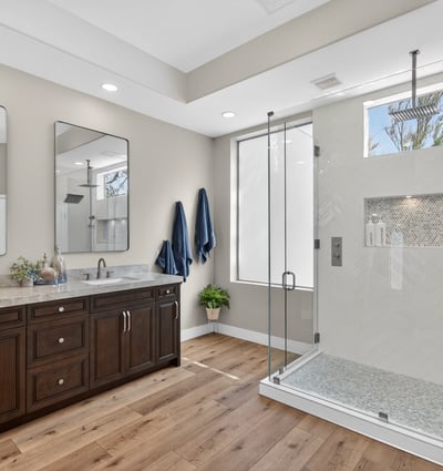Contemporary Scottsdale bathroom with a large walk-in shower, rainfall fixture, and sleek tile finishes for a spa-like experience.