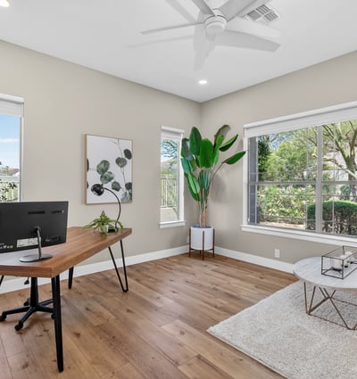 Bright Scottsdale office with large windows, wood flooring, and flexible layout ideal for work-from-home or study space.