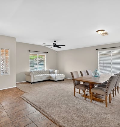 Large living and dining space with high ceilings and natural light. Flexible layout supports entertaining and comfortable living in Casa Grande.