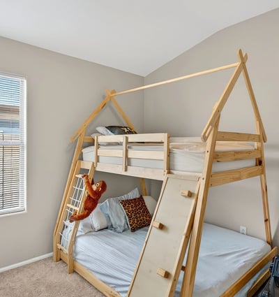 Cozy bedroom with neutral tones and natural light. Perfect for relaxation or guest use in this Casa Grande home.