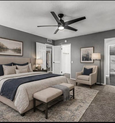 Beautifully staged bedroom emphasizing space, lighting, and modern finishes. This Sun City home showcases move-in ready interiors with contemporary updates.